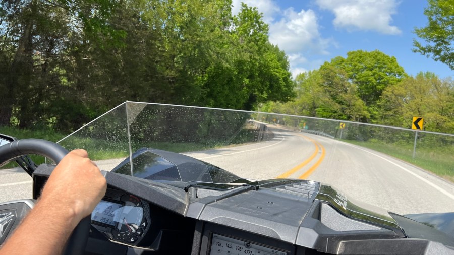 2025 Polaris Slingshot SL in a back road curve